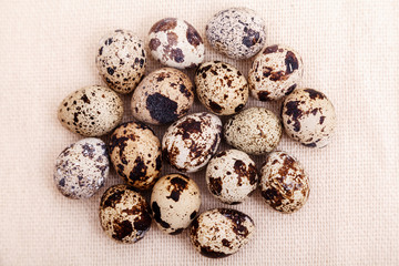 Fototapeta premium Quail eggs on burlap top view. Easter background. Healthy food, ingredient, Recipe culinary, dietary concept