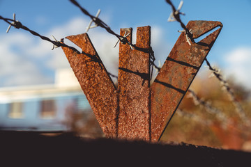 rusty barbed wire fence