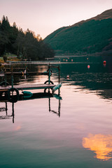 Fototapeta na wymiar sunset piers on lake