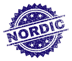 NORDIC stamp seal watermark with distress style. Blue vector rubber print of NORDIC caption with corroded texture.