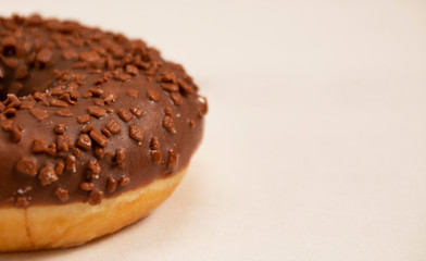 chocolate donut on a white background close-up