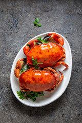 Image of Whole cooked  crabs on white plate with lemon and beer. Gray concrete background. Top view printed on Printed Glass Basin Splashbacks