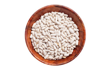 White raw beans in wooden bowl isolated on studio background. Empty copy space healthy food background.