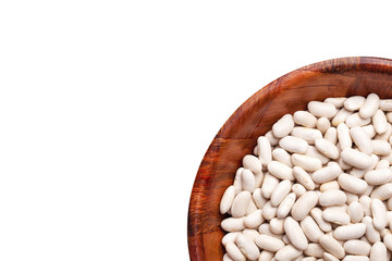 White raw beans in wooden bowl isolated on studio background. Empty copy space healthy food background.