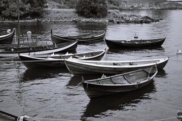 Rowing Boats in the Water, in Oslo Norway with black and white filter 