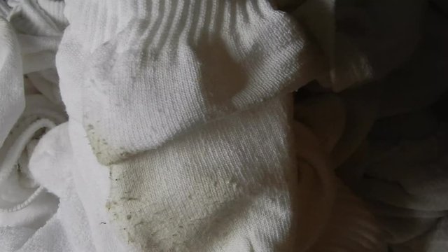 4 K Closeup Dirty White Socks Pile Pan Left To Right