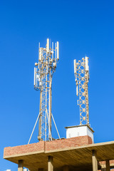 Telecommunication tower with the antennas or wireless Communication antenna transmitter against...