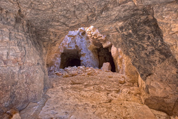 Twin Caves of Mystery. Two mysterious mineshaft caves going back into the side of Sullivan Butte in Chino Valley Arizona. The abandoned mine is on public land. Property Release is not needed.