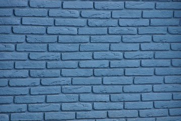 gray blue stone texture of bricks in a building wall