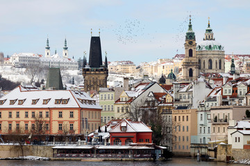 Snowy Prague Lesser Town with St. Nicholas' Cathedral, Czech republic