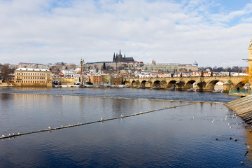 Snowy Prague Lesser Town with Prague Castle and Charles Bridge, Czech republic