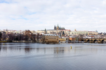 Obraz premium Snowy Prague Lesser Town with Prague Castle and Charles Bridge, Czech republic