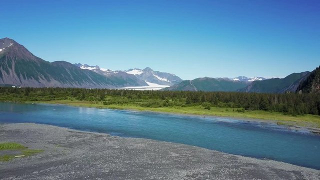 Flying Over A Small River In Alaska, Lots Of Fish Waiting To Be Caught. Fishing Trip And Adventure Holiday Concept.