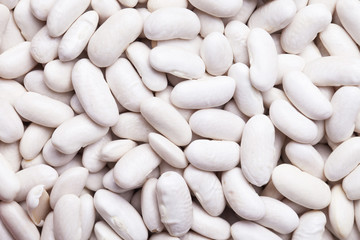 Raw uncooked white bean closeyp pattern texture.