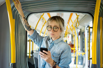 Young woman in city bus