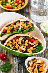 Pita Sandwiches with Grilled Chicken Salad with Chickpea or Garbanzo Beans Salad. Selective focus.