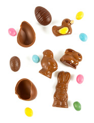 Easter composition with chocolate eggs and animals isolated on white
