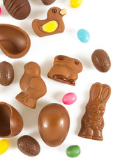 Easter composition with chocolate eggs and animals isolated on white