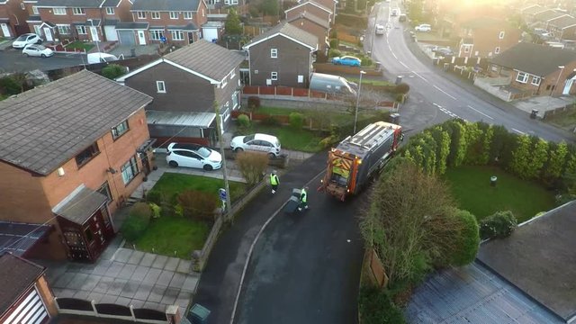 January 201, Aerial View, footage of Dustmen putting recycling waste into a garbage truck, Bin men, refuse collectors. bin lorry, Recycling day