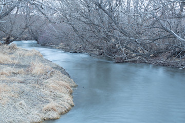 blue river winter scene with trees and snow - 247670746
