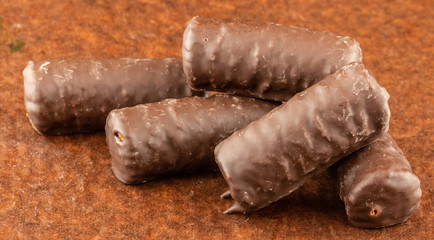 Chocolate bars on brown paper background close-up