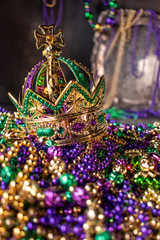 mardi gras crown and beads in green, gold, and purple © Lynne Ann Mitchell