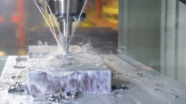 CNC milling machine in operation in an industrial machine shop.