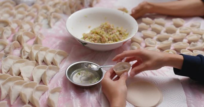 Woman make meat dumplings at home for lunar new year