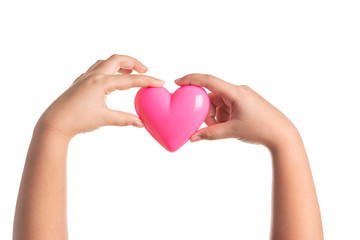 Obraz premium Pink heart on kid hand isolated on white