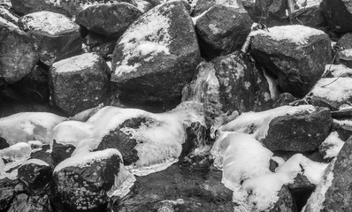 Waterfall in the forest, rocks, water, closeup, misty day.