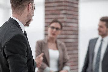 business team standing in the office hallway