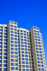Fototapeta na wymiar High-rise building under the blue sky