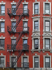 The East Village area of Manhattan on 2nd Avenue preserves older buildings with interesting art...