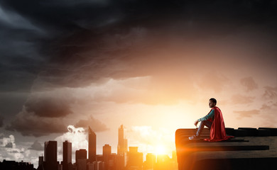 Super hero on roof. Mixed media