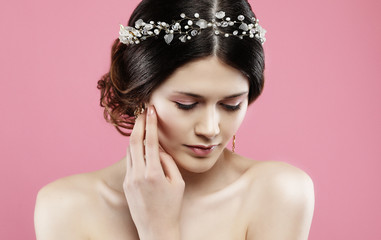 Wedding earrings on a female hand, she takes the earrings, wear earrings.