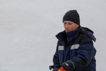 Portrait of an assembler in a blue jacket