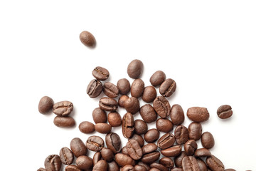 Roasted coffee beans isolated on white background. Close-up.