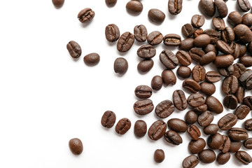 Roasted coffee beans isolated on white background. Close-up.