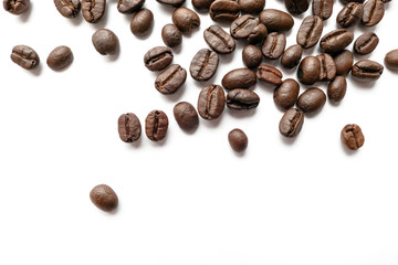 Roasted coffee beans isolated on white background. Close-up.