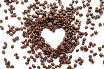 Heart frame of roasted coffee beans with area for copy space.