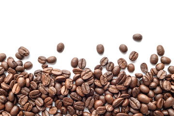 Roasted coffee beans on white background. Close-up.