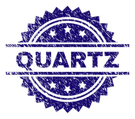 QUARTZ stamp seal watermark with distress style. Blue vector rubber print of QUARTZ caption with scratched texture.