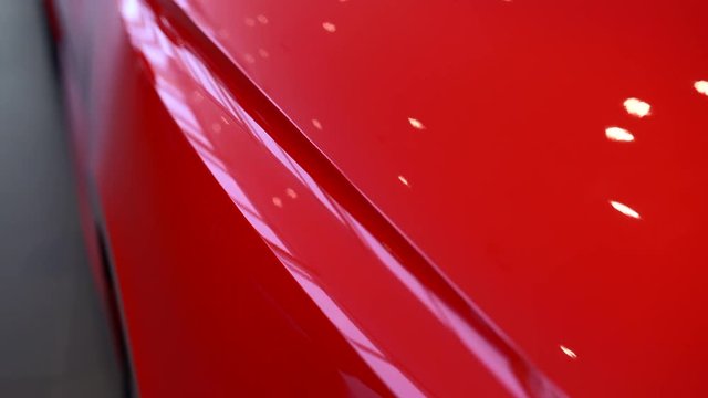 Red sports car motorized slider shot of the side curves