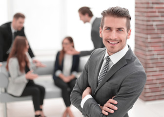 Young man in business suit smiling