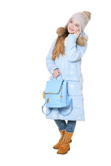 Happy little girl posing with backpack on white background