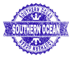 SOUTHERN OCEAN rosette stamp seal watermark with grunge style. Designed with round rosette, ribbon and small crowns. Blue vector rubber print of SOUTHERN OCEAN tag with grunge style.