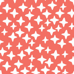 Seamless pattern background in trendy color of 2019, living coral, endless hand drawing abstract doodle of crosses or stars, snowflakes or snow, this year. Vector.