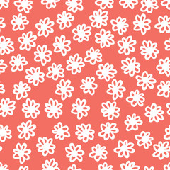 Seamless floral pattern background in trendy color of 2019, living coral, endless hand drawing abstract doodle of falling bloom flowers with petals. Vector.