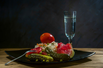 pickles and a vodka glass