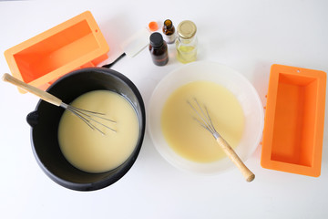 Cold handmade soap that stirs in the bowl.